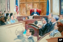 This courtroom sketch shows Paul Manafort listening to U.S. District Judge T.S. Ellis III at federal court in Alexandria, Va., Aug. 21, 2018, with a few of the jurors show at left.