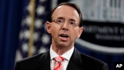 FILE - Deputy Attorney General Rod Rosenstein speaks during a news conference at the Department of Justice, July 13 2018. Rosenstein is defending the prosecution of foreign agents who may never see the inside of a U.S. courtroom.