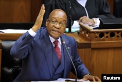 FILE - President Jacob Zuma gestures as he addresses the parliament in Cape Town, South Africa, Nov. 2, 2017.