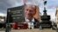 A tribute to Britain's Prince Philip is projected onto a large screen at Piccadilly Circus in London, after the announcement of the duke's death.