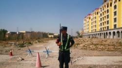 CHINA – A Chinese police officer takes his position by the road near what is officially called a vocational education centre in Yining in Xinjiang Uighur Autonomous Region, China, on Sept. 4, 2018.