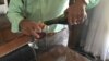 "Nabaz" pours a glass of his homemade wine "21 Rays," produced in Iraqi Kurdistan. (S. Behn/VOA)