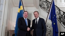 Swedish Prime Minister Stefan Lofven, left, welcomes President of the European Council Donald Tusk at his official residence in Stockholm, Oct. 9, 2017, for a dinner ahead of next week's EU summit.