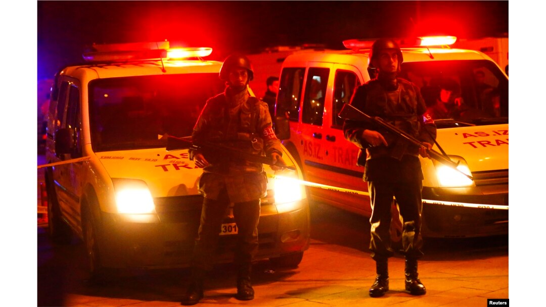 Turkish soldiers stand guard near the site of an explosion in Ankara, Feb. 17, 2016.