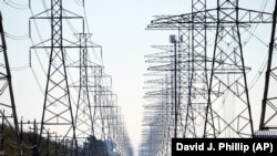 FILE: Representative illustration of high-voltage electric transmission lines. Taken 2.16.2021