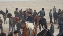 Ethnic Uyghurs play a horseback game called 'oghlak tartish' outside the city of Korla, in China's Xinjiang Uyghur Autonomous Region, on March 21, 2011.