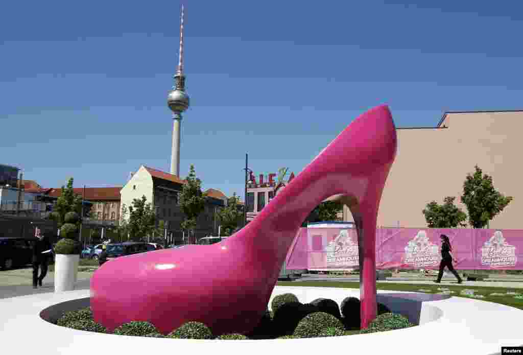 A giant shoe is pictured outside a life-size &quot;Barbie Dreamhouse&quot; of Mattel&#39;s Barbie dolls in Berlin, Germany. The house, covering about 1,400 square meters offers, visitors to try on Barbie&#39;s clothes in her walk-in closet,&nbsp; and tour her room and her kitchen.