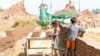 Two boys were placing bricks on a wooden cart at a brick factory in Cambodia. (Courtesy photo of Licadho)