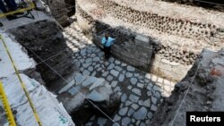 Raul Barrera, an archaeologist from the National Institute of Anthropology and History, speaks to the media about new Aztec discoveries including the main temple of the wind god Ehecatl, a major deity, as well as an adjacent ritual ball court, located just off the Zocalo plaza in Mexico City, Mexico, June 7, 2017. 