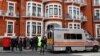 A police van is seen outside the Ecuadorian embassy after WikiLeaks founder Julian Assange was arrested by British police in London, Britain, Apr. 11, 2019.