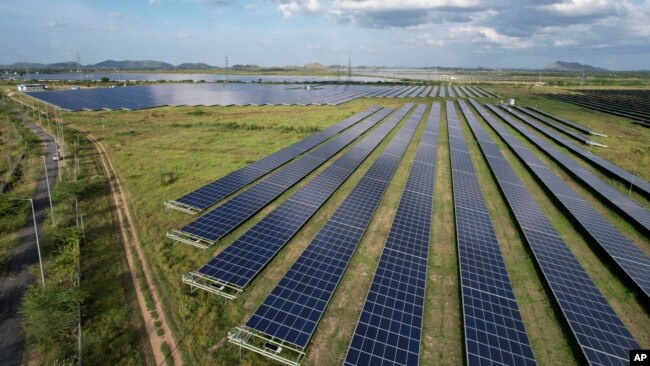 A solar power plant works in Pavagada Tumkur district, in the southern Indian state of Karnataka, India, Thursday, Sept. 15, 2022.