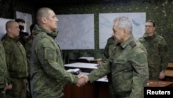 Russian defence minister pays rare visit to troops in Ukraine