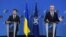 FILE - Ukrainian President Volodymyr Zelenskiy, left, and NATO Secretary General Jens Stoltenberg are seen during a press conference after their bilateral meeting at European Union headquarters in Brussels, Belgium, Dec. 16, 2021.