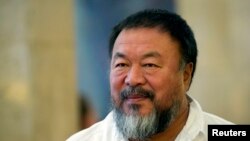 FILE - Dissident Chinese artist Ai Weiwei arrives at the town hall in Berlin, Germany.