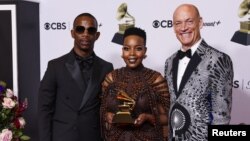 South African musicians Wouter Kellerman, Zakes Bantwini and Nomcebo Zikode pose with the Grammy for Best Global music performance for "Bayethe" at the 65th Annual Grammy Awards in Los Angeles, California, February 5, 2023.