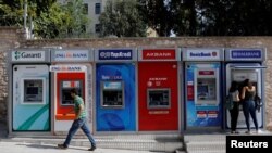 FILE - A row of ATMs in Istanbul, Turkey, September 12, 2017.