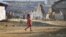 A refugee child from Burma's Bhamo city walks inside a rescue camp in the Chinese southwestern border city of Longchuan, Yunnan province February 10, 2012. In an obscure part of southwest China, a refugee crisis from one of the world's longest running and