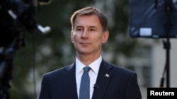 British Foreign Secretary Jeremy Hunt prepares to give an interview outside his home in London, Britain, June 24, 2019. 