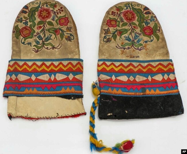 This undated photo provided on Wednesday, July 20, 2022, by Gregory Scofield, shows two mittens he made in the late 19th-century Cree-Metif native Canadian traditional style. The Vatican's Anima Mundi Ethnological Museum houses tens of thousands of artifacts and art made by Indigenous peoples from around the world. (Gregory Scofield via AP)