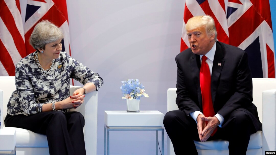 Britain's Prime Minister Theresa May talks with U.S. President Donald Trump during the G-20 leaders summit in Hamburg, Germany, July 8, 2017. Britain's Prime Minister Theresa May talks with U.S. President Donald Trump during the G-20 leaders summit in Ha