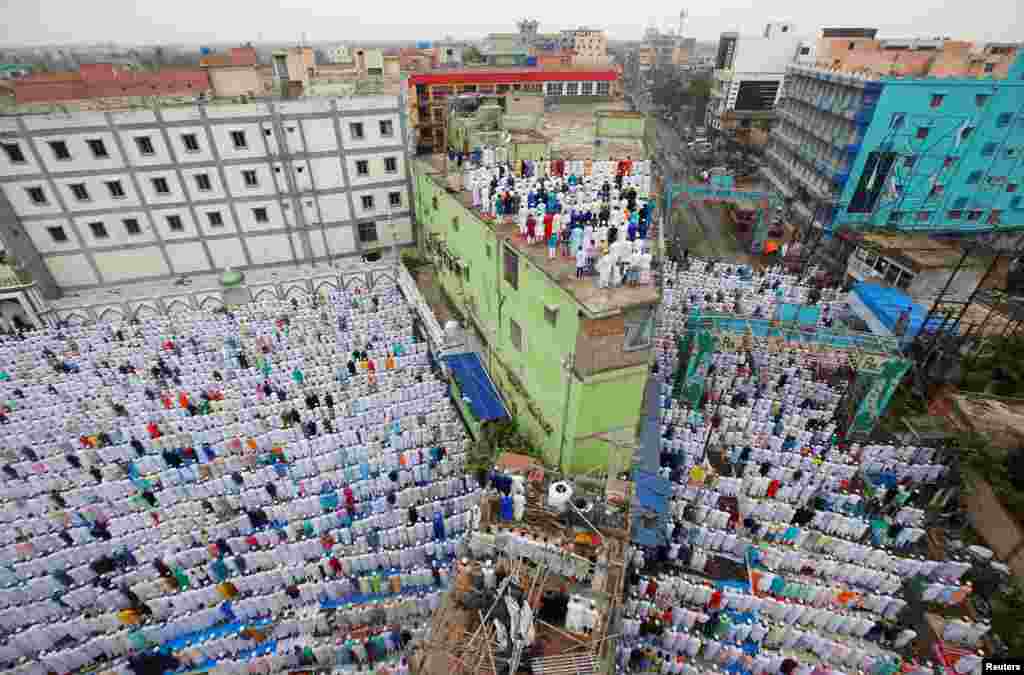 Muslims offer Eid al-Fitr prayers marking the end of the holy fasting month of Ramadan in Howrah, on the outskirts of Kolkata, India.