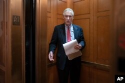 Sen. Angus King, I-Maine, departs the Senate following defense arguments by the Republicans in the impeachment trial of President Donald Trump on charges of abuse of power and obstruction of Congress, Jan. 25, 2020.