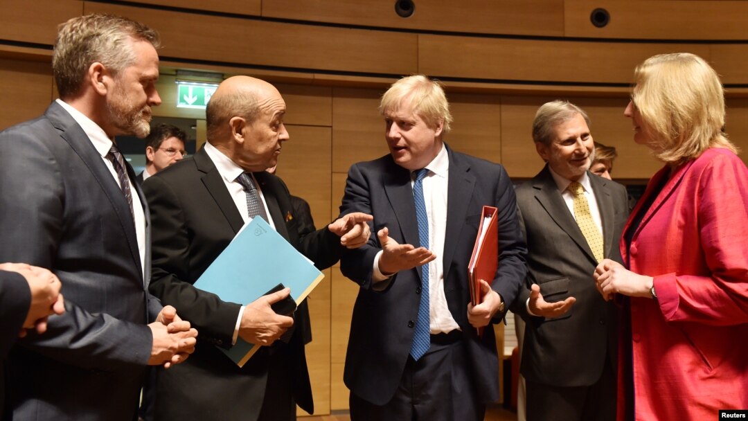 Danish Foreign Minister Anders Samuelsen and French Minister for Foreign Affairs Jean-Yves Le Drian talk with Britain's Foreign Secretary Boris Johnson, European commissioner Johannes Hahn and Austrian Foreign Minister Karin Kneissl during an EU foreign minister meeting in Luxembourg, April 16, 2018.