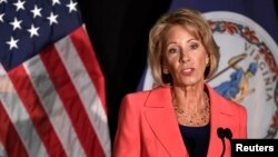 FILE - Education Secretary Betsy DeVos makes remarks during a major policy address on Title IX enforcement, which in college covers sexual harassment, rape and assault, at George Mason University, in Arlington, Virginia, Sept. 7, 2017. 