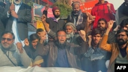 Pasban-e-Hurriyat Jammu and Kashmir activists shout slogans in Pakistan, on Dec. 11, 2023, as they protest against India's Supreme Court upholding the 2019 repeal of Kashmir's special status.