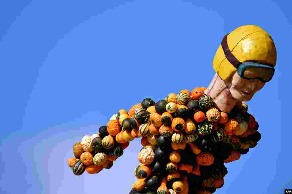 A ski jumper made of pumpkins is seen at the Experience Farm in Klaistow, Germany during a traditional pumpkin exhibition.