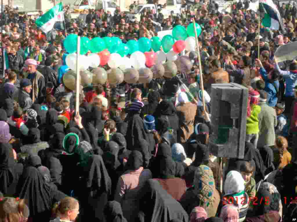 Demonstrators take part in a protest against Syria's President Bashar al-Assad in Marat al-Numan near the northern province of Idlib on February 5, 2012. (Reuters)