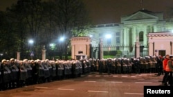 People gather at a makeshift camp at the United Nations Mission in South Sudan (UNMISS) compound in Juba, Dec. 22, 2013, a week after South Sudan erupted in violence.