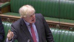 FILE - Britain's Prime Minister Boris Johnson gestures during the weekly question time debate in Parliament in London, Sept. 30, 2020, in this screen grab taken from video.
