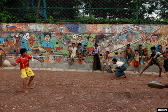 Rohingya children plays with a ball on the road, inside a refugee camp, in Cox's Bazar, Bangladesh, September 28, 2024. (REUTERS)