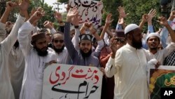 Supporters of a religious group hold a demonstration in Lahore, Pakistan, on Sept. 30, 2023, to condemn Friday's deadly bombing in Mastung.