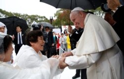 Pope Francis greets wellwishers at the Atomic Bomb Hypocenter Park in Nagasaki, Japan, Nov. 24, 2019.