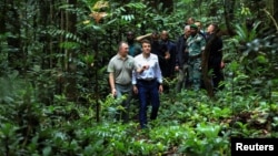 FILE: French President Emmanuel Macron and Gabon's Minister of Water and Forests Lee White visit the Mondah classified forest, on the sidelines of the One Forest Summit in Libreville, Gabon. Taken Mar.2, 2023