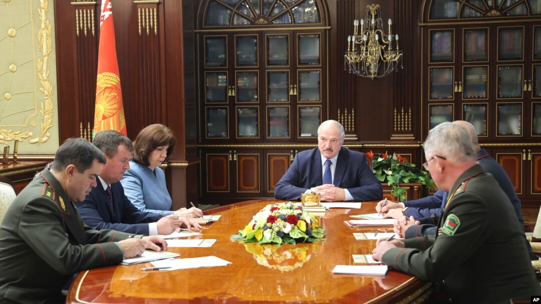 Belarusian President Alexander Lukashenko, center, chairs a meeting of the country's Security Council, in Minsk, Belarus, July 29, 2020. 