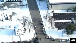 Image provided by WPVI-TV/6ABC shows police responding to a report of an active shooter at a United Parcel Service facility in Logan Township, N.J., Jan. 14, 2019. 
