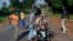 FILE - Armed anti-balaka militiamen man a checkpoint some 60 kms north of Bangui, Central African Republic, Sunday June 1, 2014. 