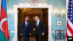 Azerbaijan's Foreign Minister Jeyhun Bayramov meets with U.S. Secretary of State Mike Pompeo to discuss the conflict in Nagorno-Karabakh, at the State Department in Washington, Oct. 23, 2020. 