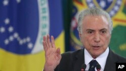 FILE - Brazil's President Michel Temer speaks during a swearing ceremony for the newly-named Foreign Minister Aloysio Nunes and Justice Minister Osmar Serraglio, at the Planalto Presidential Palace, in Brasilia, Brazil, March 7, 2017.