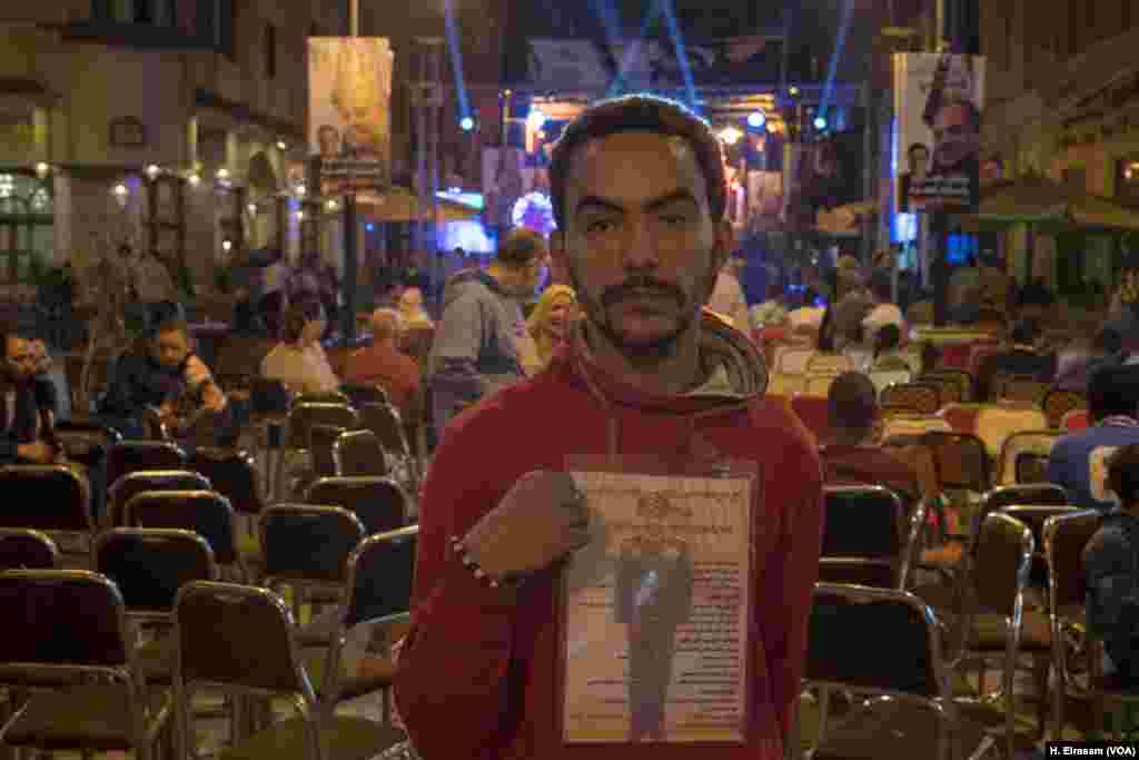 El-Sissi supporter Mohamed Essam says “I trust the military and any figure will come from a military background, and president Sissi is the best.” Essam was at a rally in downtown Cairo, March 20, 2018.