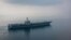 The aircraft carrier USS Carl Vinson (CVN 70) transits the Sunda Strait. The Carl Vinson Carrier Strike Group is on a regularly scheduled Western Pacific deployment.