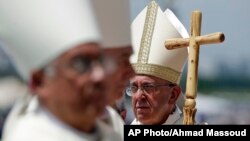 Pope Francis walks with his pastoral staff to celebrate a Mass in Guayaquil, Ecuador, July 6, 2015. 