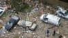 People inspect the damage at the site of an overnight Israeli airstrike that targeted the Shayyah neighborhood in Beirut’s southern suburbs on November 26, 2024, amid the ongoing war between Israel and Hezbollah.