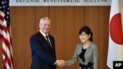 U.S. Defense Secretary Jim Mattis, left, and Japanese Defense Minister Tomomi Inada pose for a photo prior to their meeting at Defense Ministry in Tokyo, Feb. 4, 2017. 