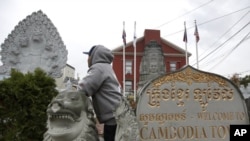 In this Sept. 26, 2019 photo, a man of Cambodian descent, who has lived in the United States since childhood and is now facing possible deportation, poses in Lowell, Mass. (AP Photo/Elise Amendola)