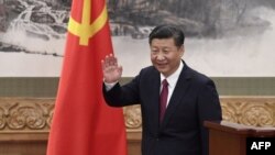 Chinese President, and General Secretary of the Communist Party Xi Jinping waves 