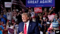 President Donald Trump stands on stage after speaking at a campaign rally at Smith Reynolds Airport, Sept. 8, 2020, in Winston-Salem, N.C. 